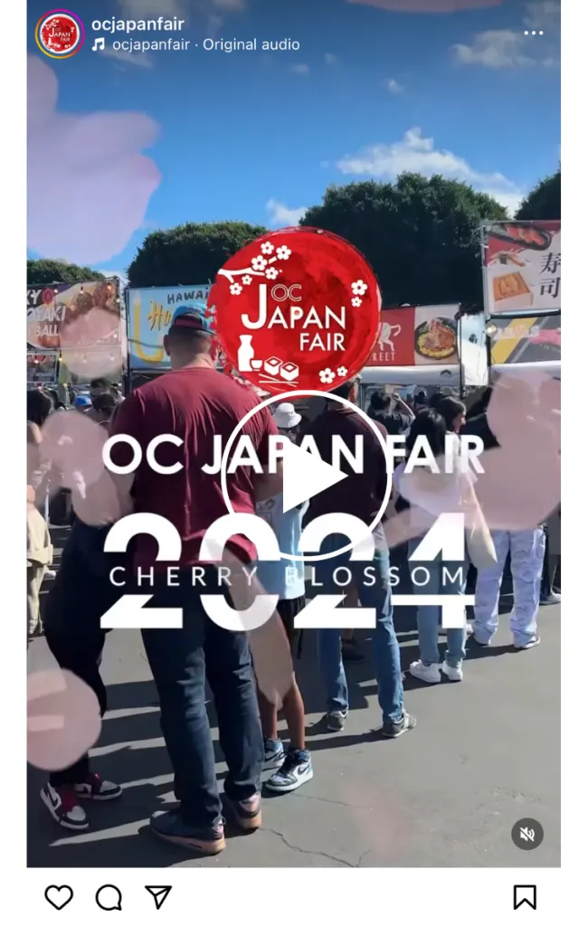 People stand in line at an outdoor event with food booths in the background. Text overlay reads OC Japan Fair 2024 Cherry Blossom. Pink cherry blossom graphics are scattered across the image.