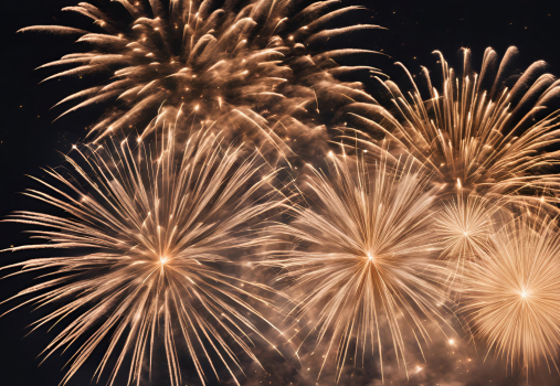 Golden fireworks burst against a dark night sky, filling the scene with sparkling light and dramatic, radiating patterns.