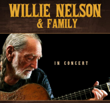Poster for Willie Nelson & Family In Concert featuring an older man with long hair and a beard, playing an acoustic guitar against a dark background. Bold yellow text is at the top.