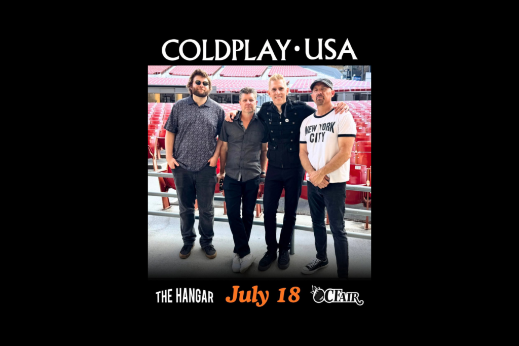 Four men stand together in a stadium with empty red seats. Text above reads COLDPLAY USA. Below, it says The Hangar July 18 OC Fair. The group poses casually, smiling at the camera.
